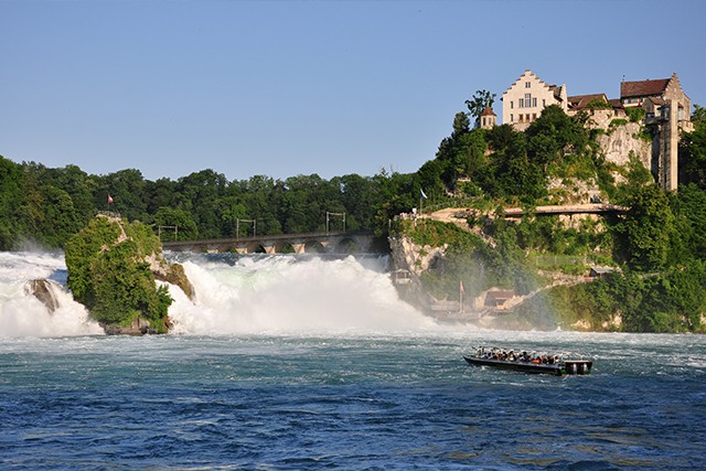 Austria Marvel at the biggest waterfall in Europe on Day 5 of our Lake Constance Cycling holiday. Located in mediaeval Stein am Rhein is the tumbling Rheinfall waterfall, above which a tiny castle (Schloss Laufen) perches precariously.